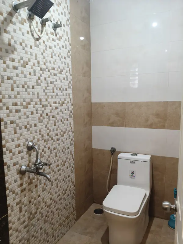 2 BHK bathroom with shower and western toilet