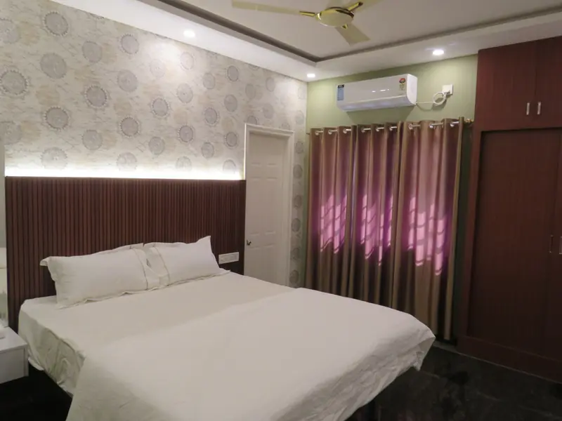 2 BHK bedroom with air conditioner and wardrobe