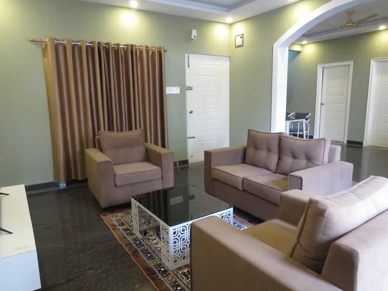 2 BHK sofa seating with rug and centre table