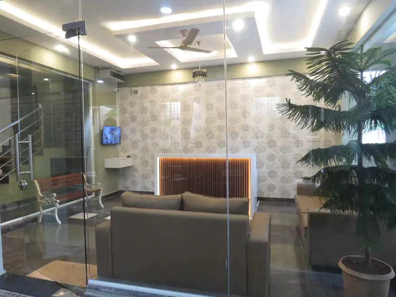 Reception desk and waiting area at Naayab Suites