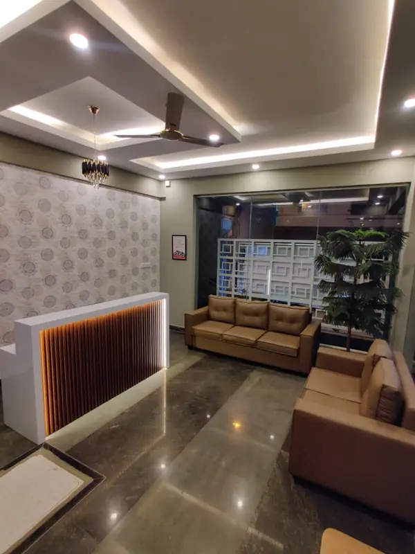 Reception desk with leather sofas in the lobby
